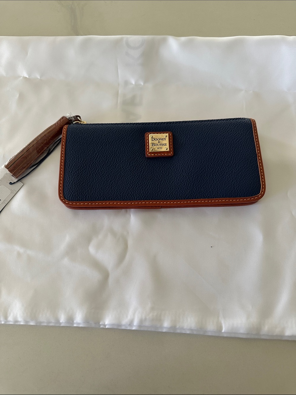 Dooney & Bourke Navy Pebbled Leather Zip Wallet with Brown Trim